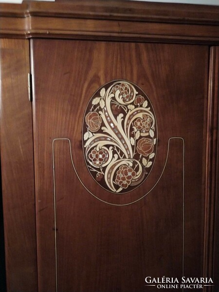 A pair of Art Nouveau wardrobes with marquetry inserts