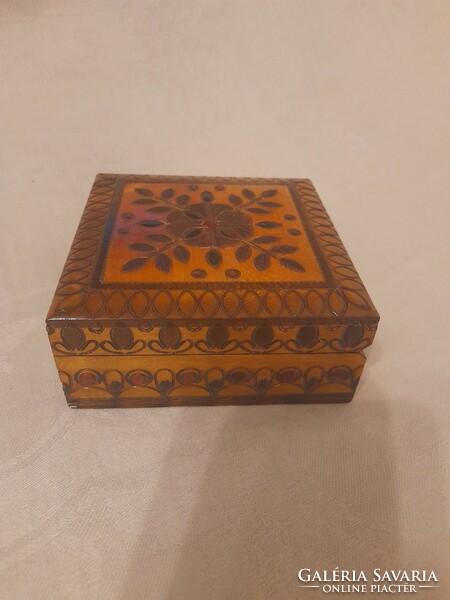 Richly carved colored wooden box