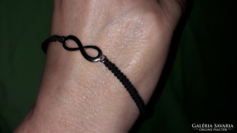 Handcrafted bracelet with a whimsical tear in the sign of eternal life, according to the pictures k 9.