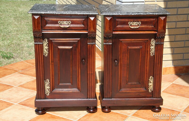 A pair of German marble bedside tables left and right