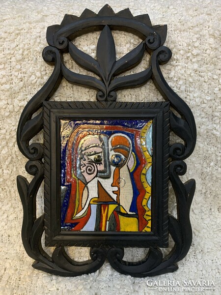 In a large frame, a larger fire enamel picture after Picasso freely in a special real carved wooden frame