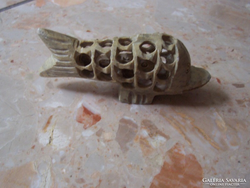 Carved dolphin with fish in its stomach