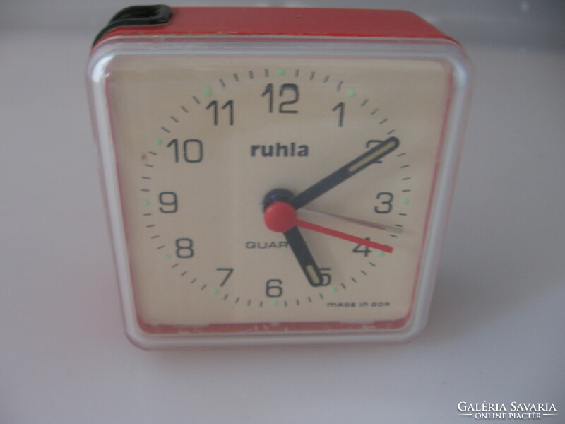 Retro dusty cloth alarm clock in need of repair