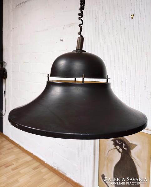 An industrial-style pendant designed by Béla Nádas