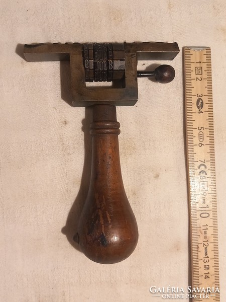 Old stamp, stamp press from the 1940s
