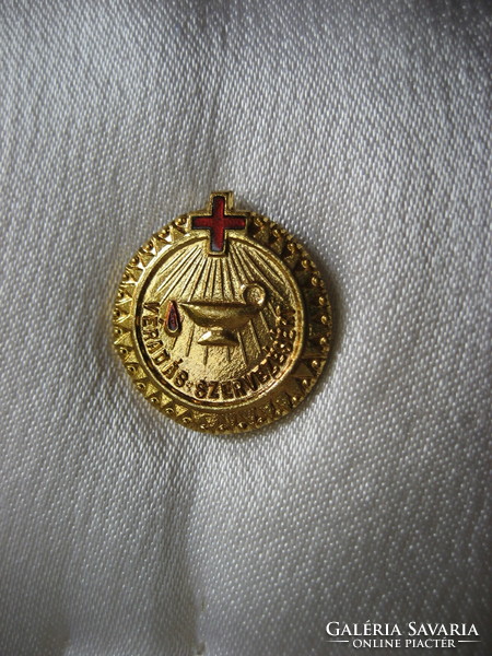 Gold award and badge for organizing blood donation