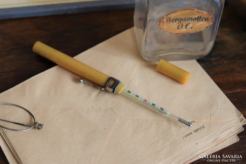 Vintage medical device mercury nurse thermometer with clip