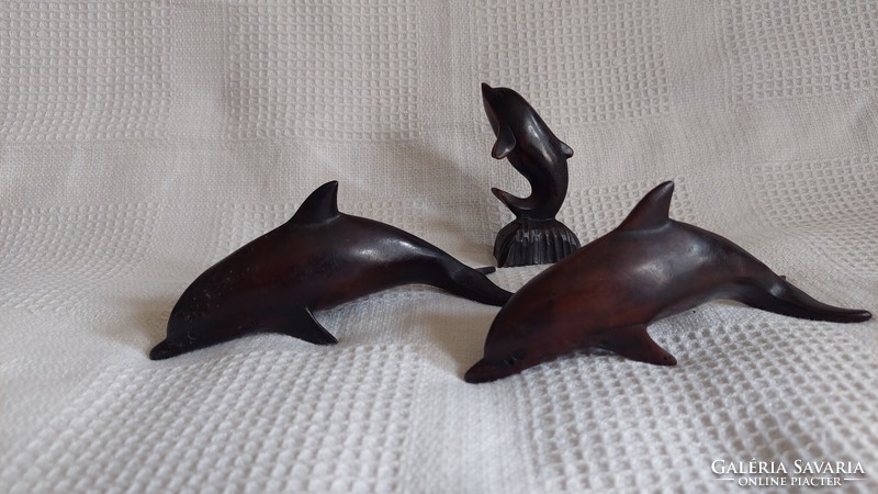 3 dolphin statues