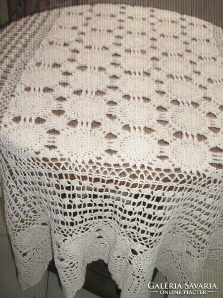 Hand-crocheted tablecloth with antique ecru art nouveau features