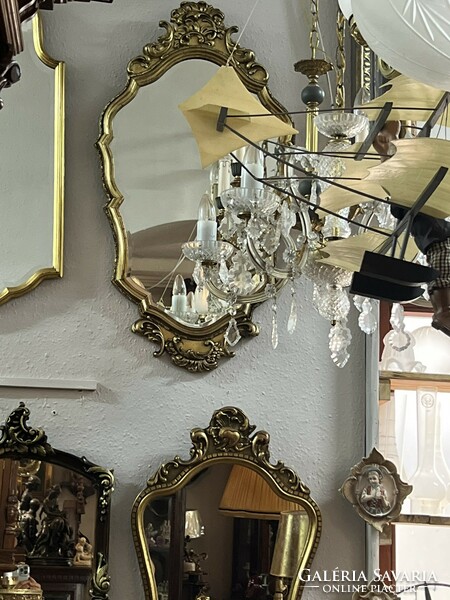Ornate metal framed baroque style wall mirror