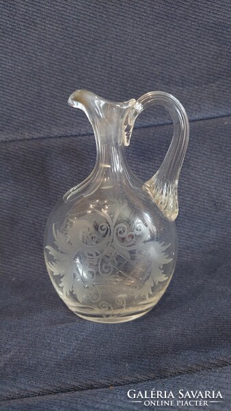 Polished, etched old glass spout
