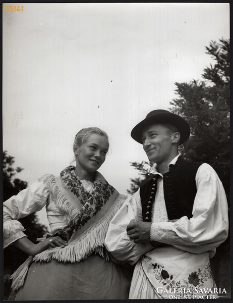 Larger size, photo art work by István Szendrő. Young couple in dove folk costume, pigeons,