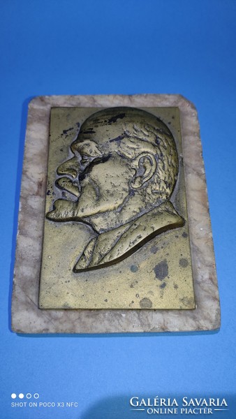 Bronze plaque on a marble base