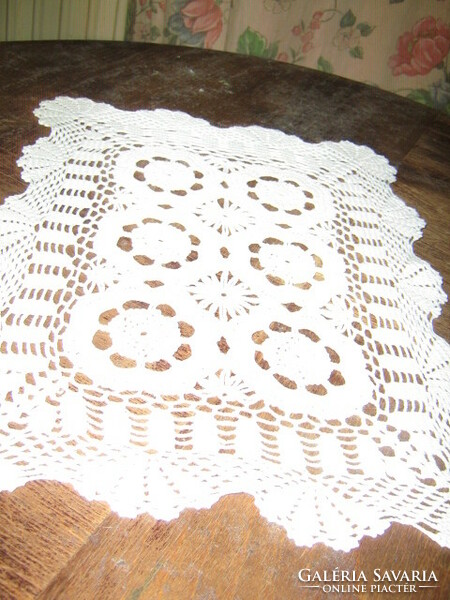 Beautiful hand-crocheted snow-white lace tablecloth