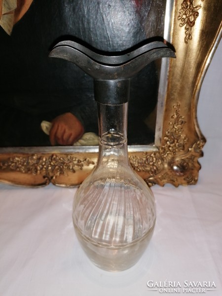 Glass drinking bottle with silver head