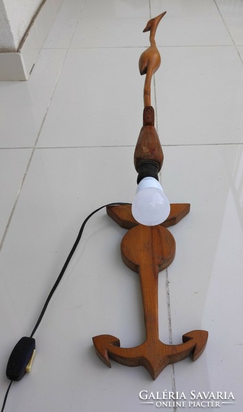 Wooden wall lamp with crane and anchor decoration