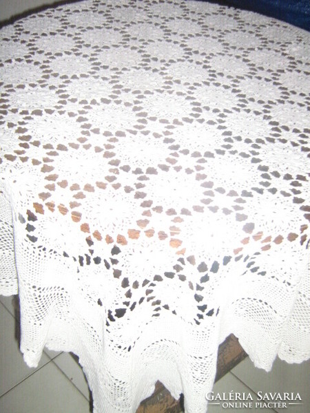 Hand-crocheted tablecloth with antique snow-white Art Nouveau features