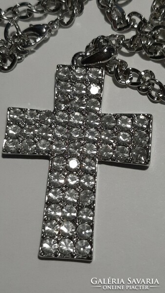 A large cross pendant necklace studded with beautiful crystals