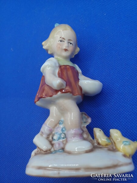 Porcelain girl with chicks