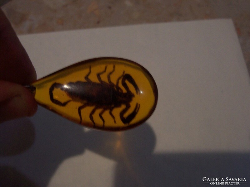 Scorpio pendant cast in amber