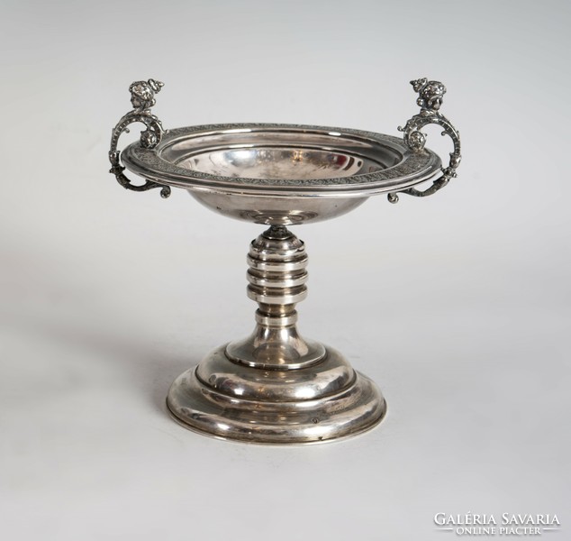 Silver centerpiece with plastic female heads