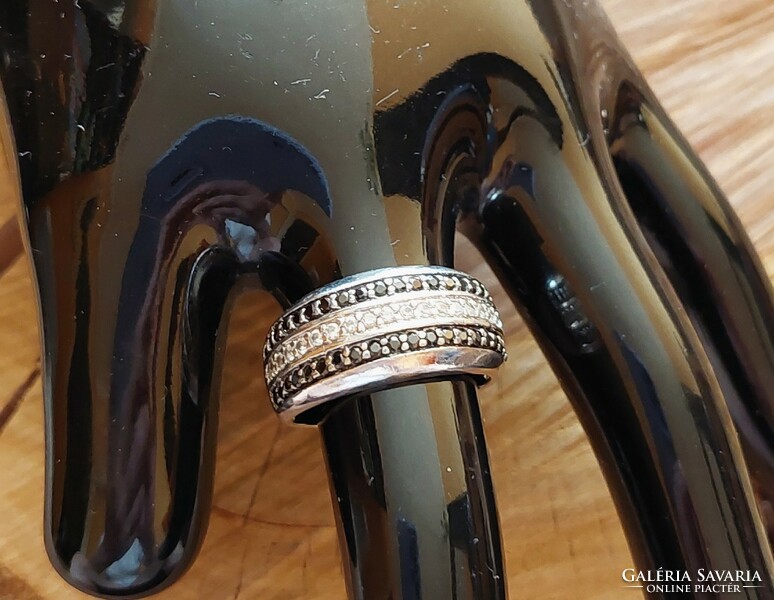 Silver ring with black and white zirconia stones