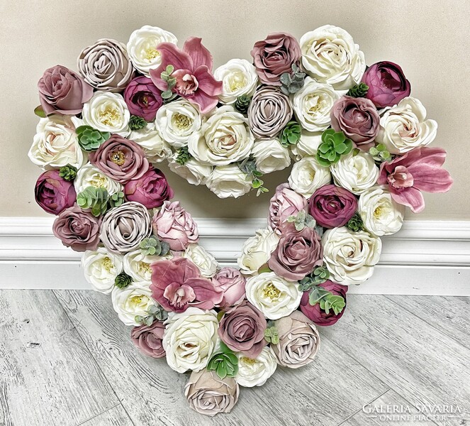 A beautiful giant heart with flower decorations and silk flowers