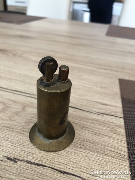 Copper antique lighter.
