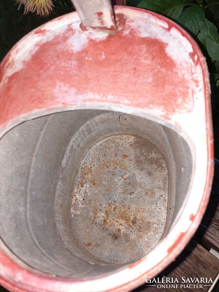 Found an antique tin watering can in used condition - more like a decoration