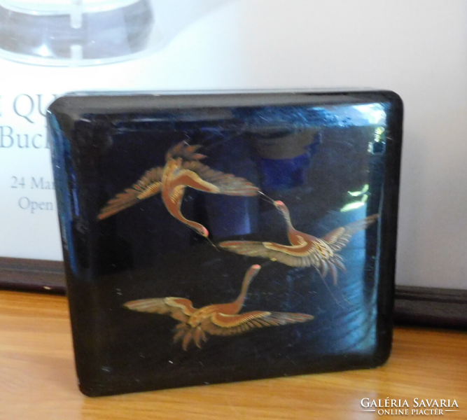 Old oriental lacquer box with cranes