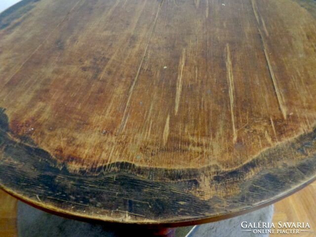 Antique imposing massive round table with copper decoration
