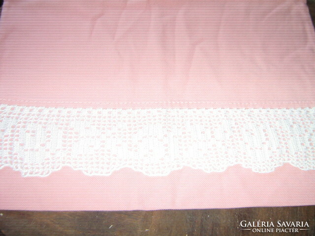 Pink woven decorative pillow decorated with a beautiful handmade crochet rose pattern