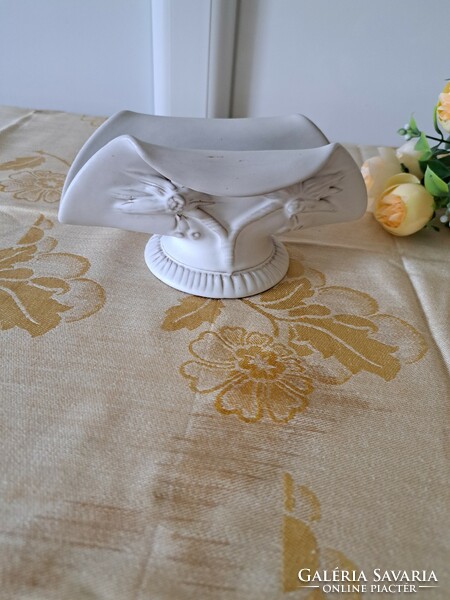 Off-white ceramic candle holder and napkin holder