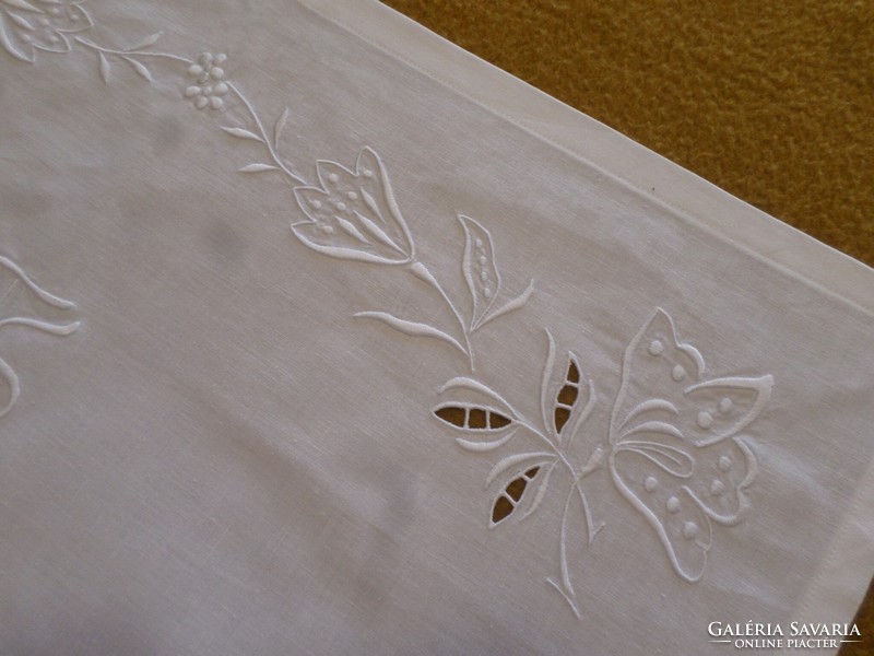 Snow white embroidered, monogrammed shelf cover.