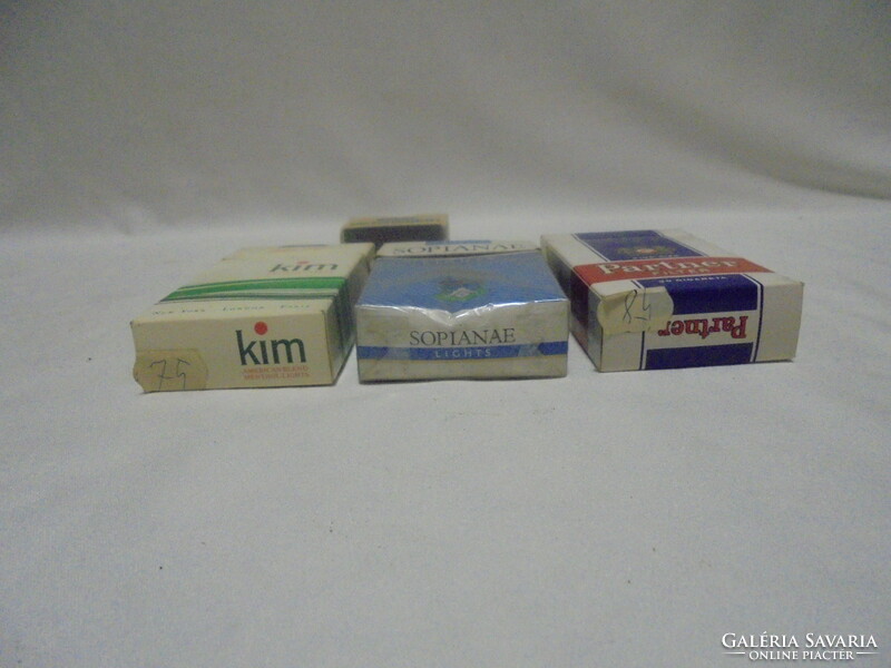 Three cigarettes, cigarette paper, bag, box, packaging together - sopianae, partner, kim