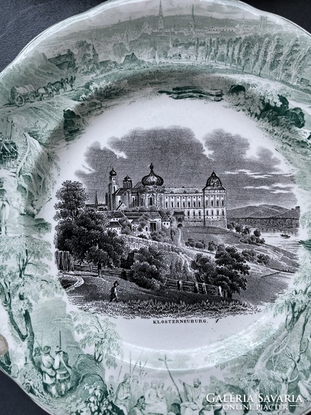 Nicely matured, antique, black and white cityscape, decorated with a green life picture around the earthenware plates