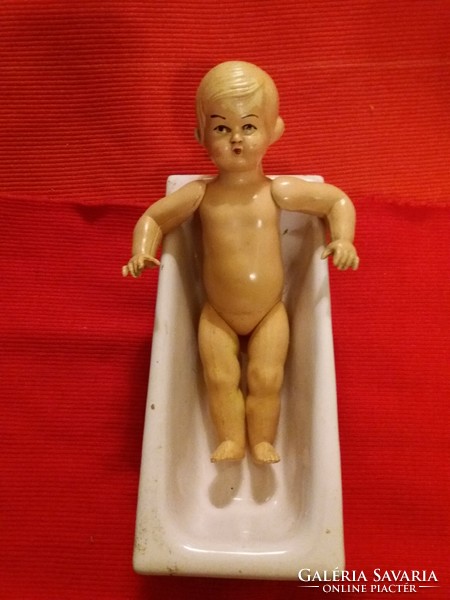 Antique toy minerva celluloid doll with metal cast iron bathtub as shown in the pictures