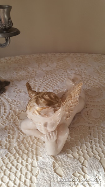 Heavy gilded porcelain, lying angel face 20 cm.