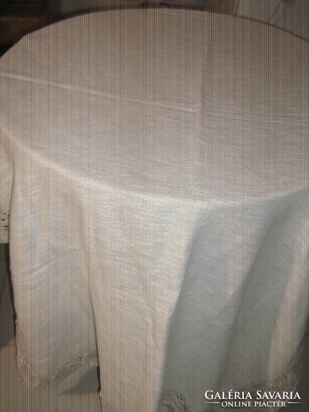 Beautiful antique beige woven tablecloth with lace edges
