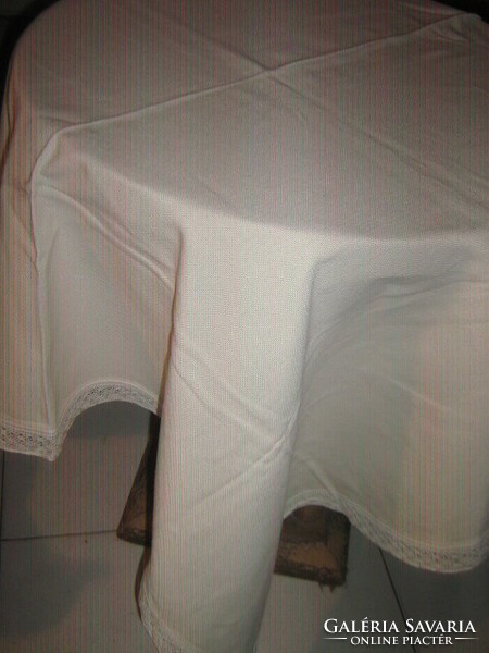 Wonderful elegant beige woven tablecloth with lacy edges