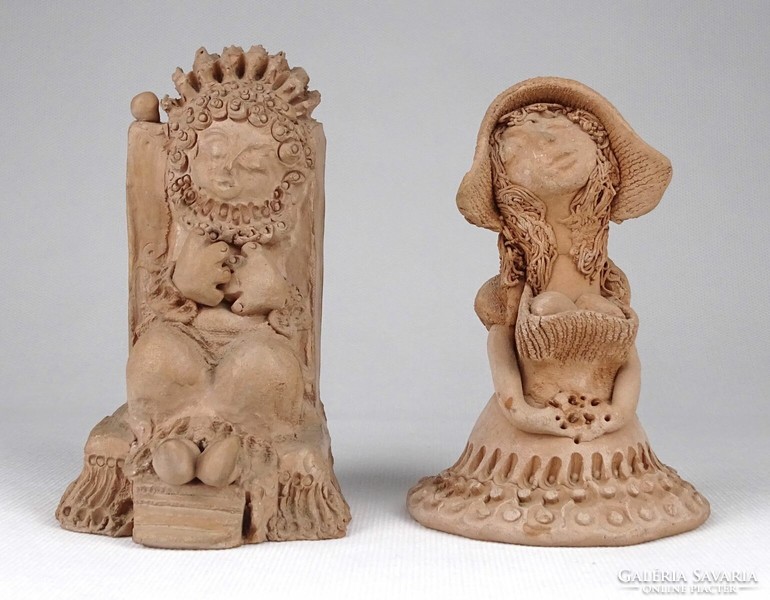 Pair of unglazed ceramic figurines marked 1O733