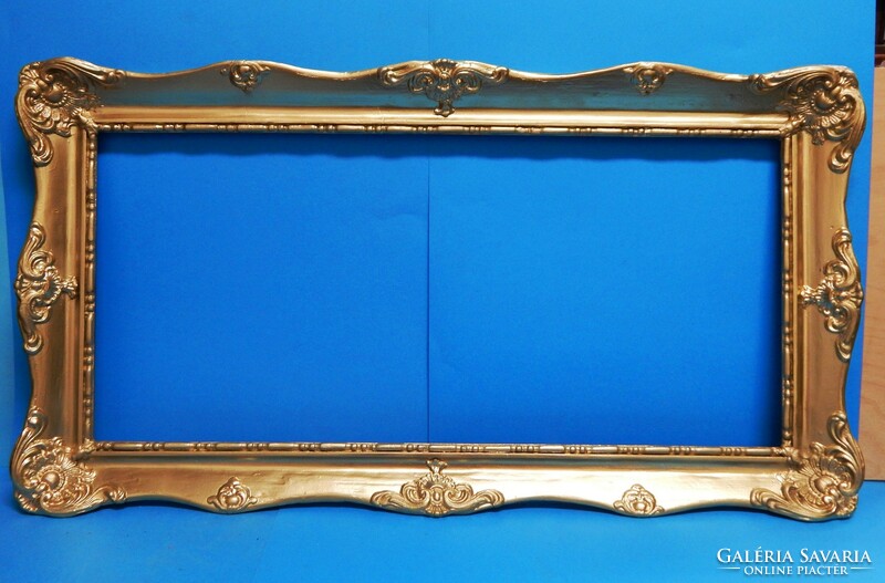 Flawless frame in metallic gold for a 76 x 35 cm picture
