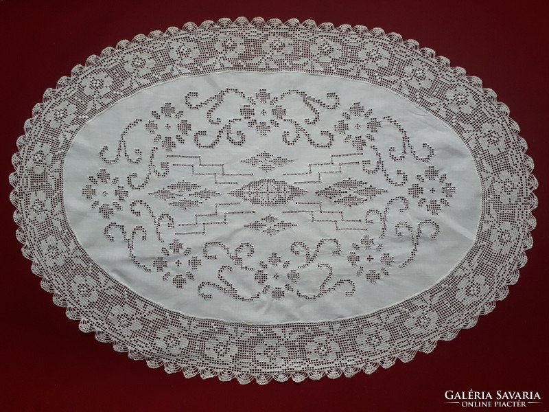Showcase tablecloth decorated with oval cut embroidery and crochet