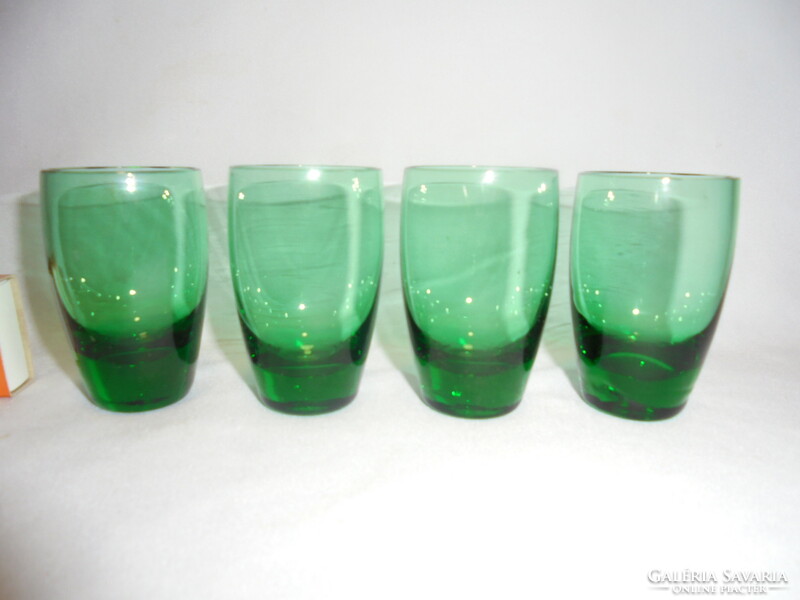 Four old, green, thick-bottomed glass liqueur, short drink, brandy glasses - together