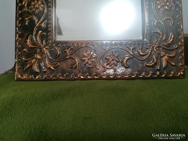 Industrial copper frame wall mirror with a folk motif