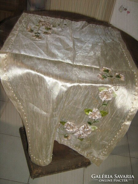 A special floral tablecloth with beautiful handmade ribbon embroidery