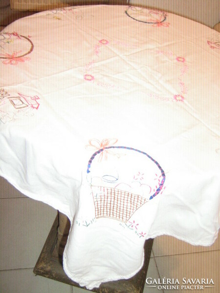 Beautiful hand-embroidered Easter tablecloth with lacy edges