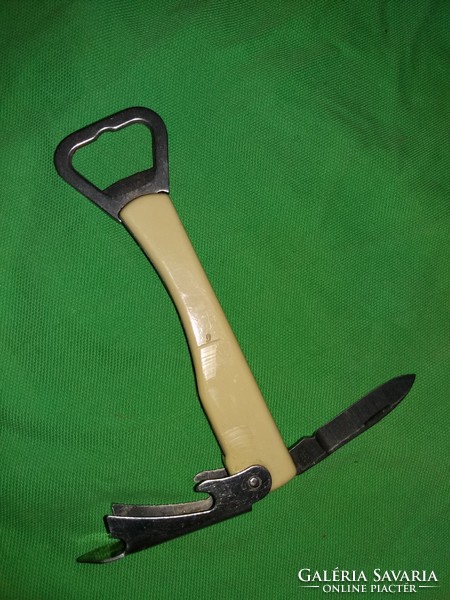 Old vinyl-handled multi-functional knife beer and wine bottle opener according to the pictures