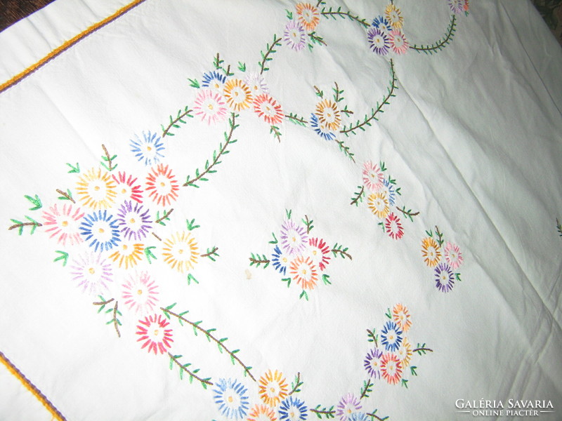 Beautiful antique stained-glass curtain with hand-embroidered flowers in folk traditions
