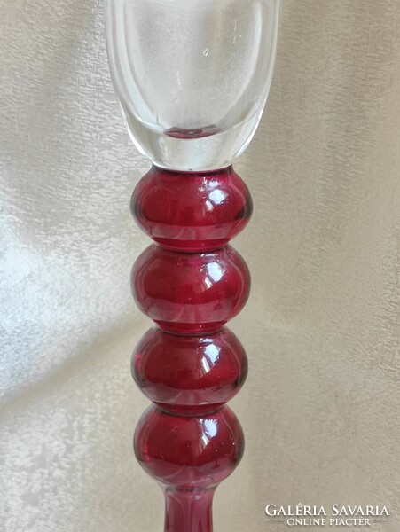 Burgundy monofilament glass candle holder.